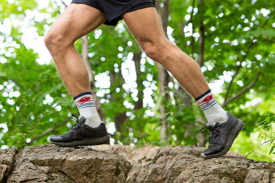 A trail runner wearing the merino wool Pacer socks, which keep your feet the perfect temperature