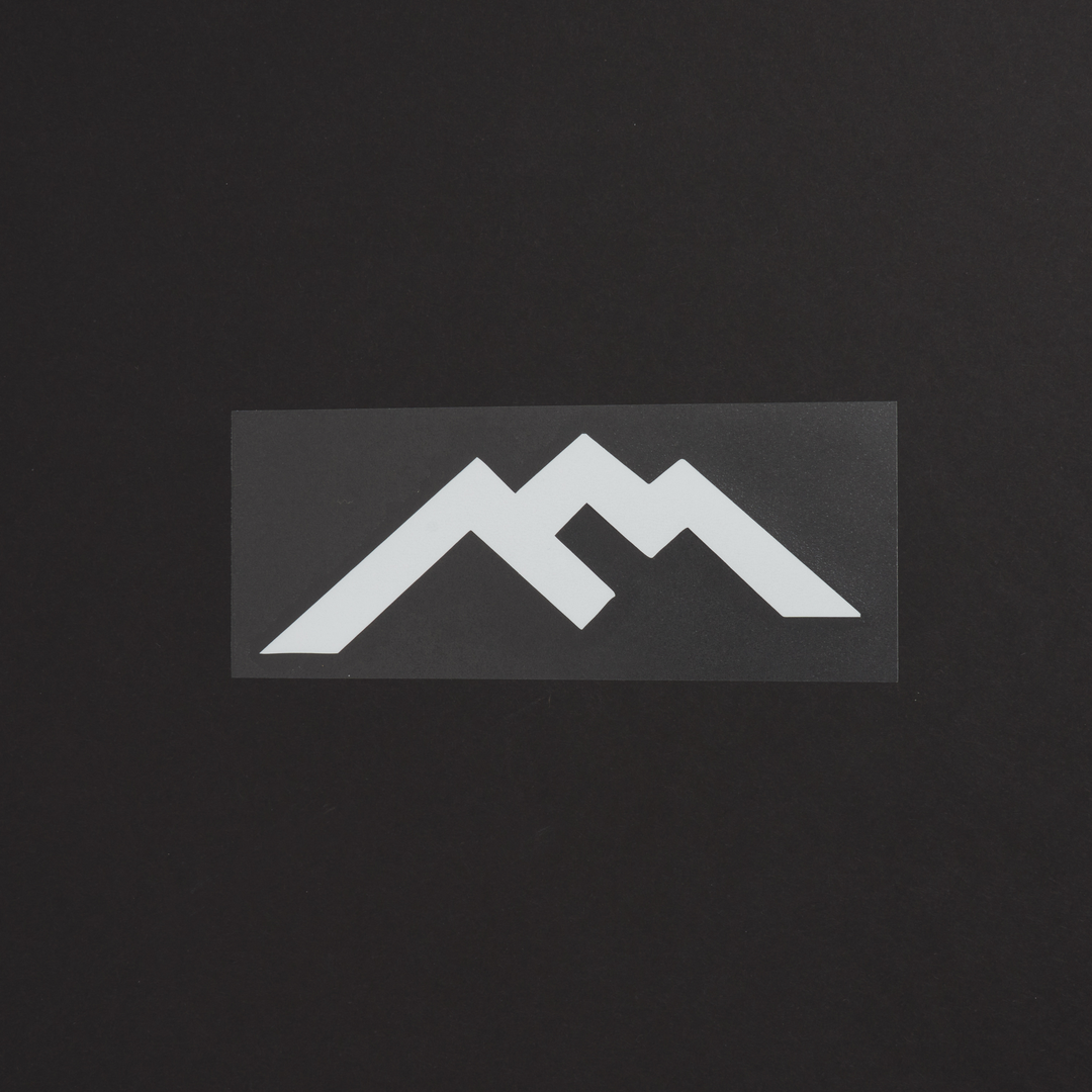 White Darn Tough Mountain Logo sticker on black background