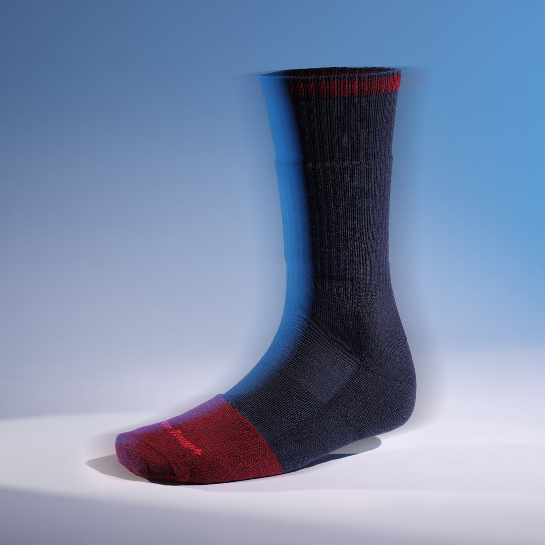 Sock on form in blurry image of the 2006 steely boot in limited edition in navy