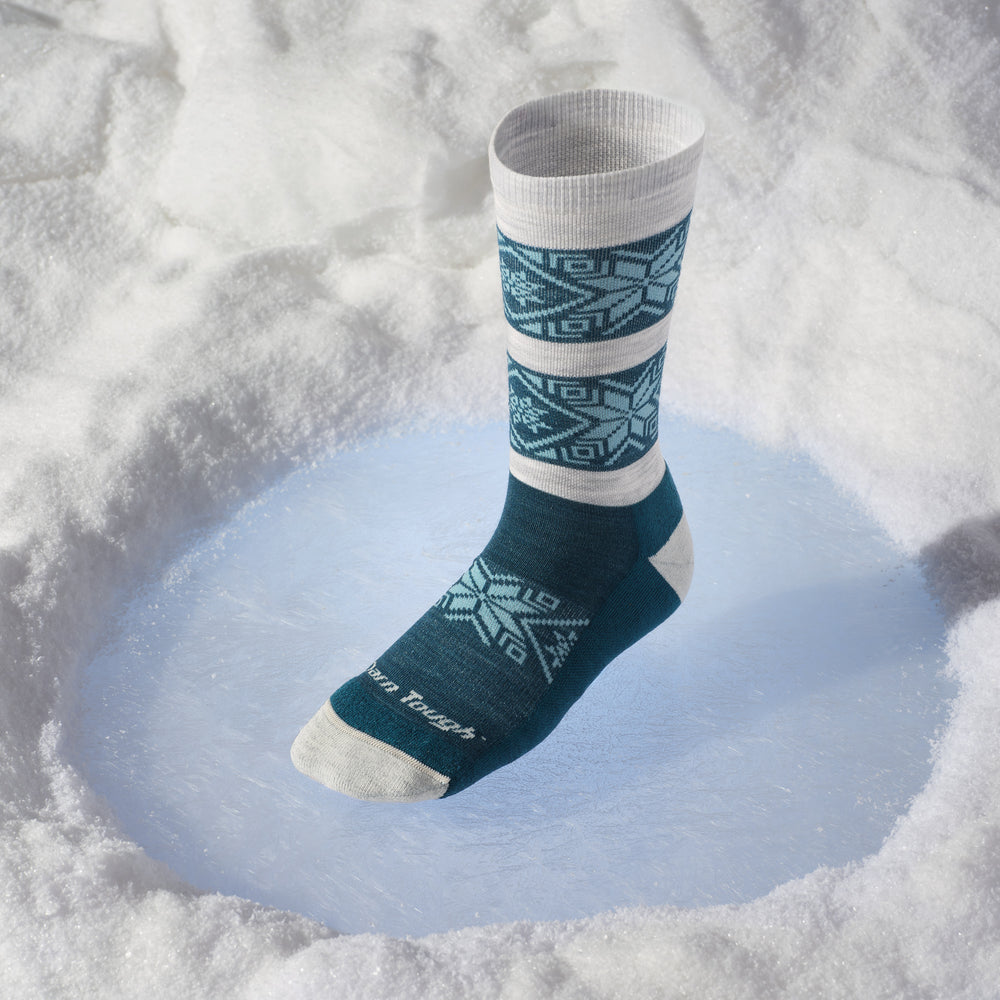 elsa crew sock on ice spot in the snow 
