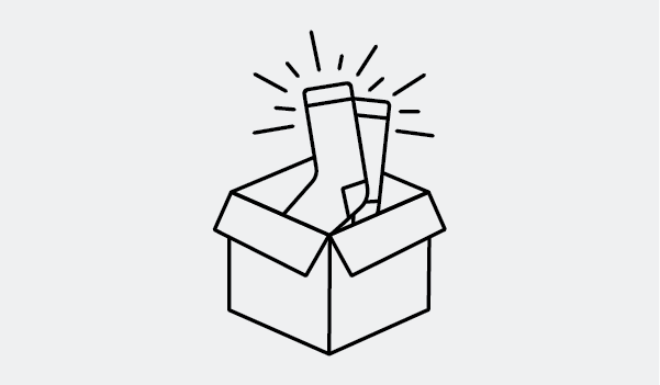 A new pair of Darn Tough socks in a box
