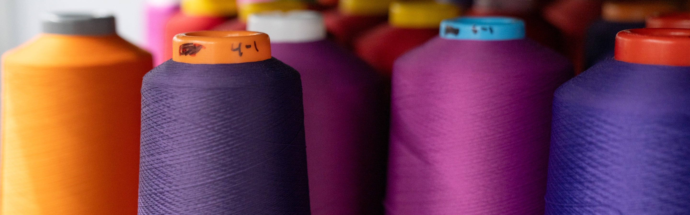 Rows of sock knitting yarn from above