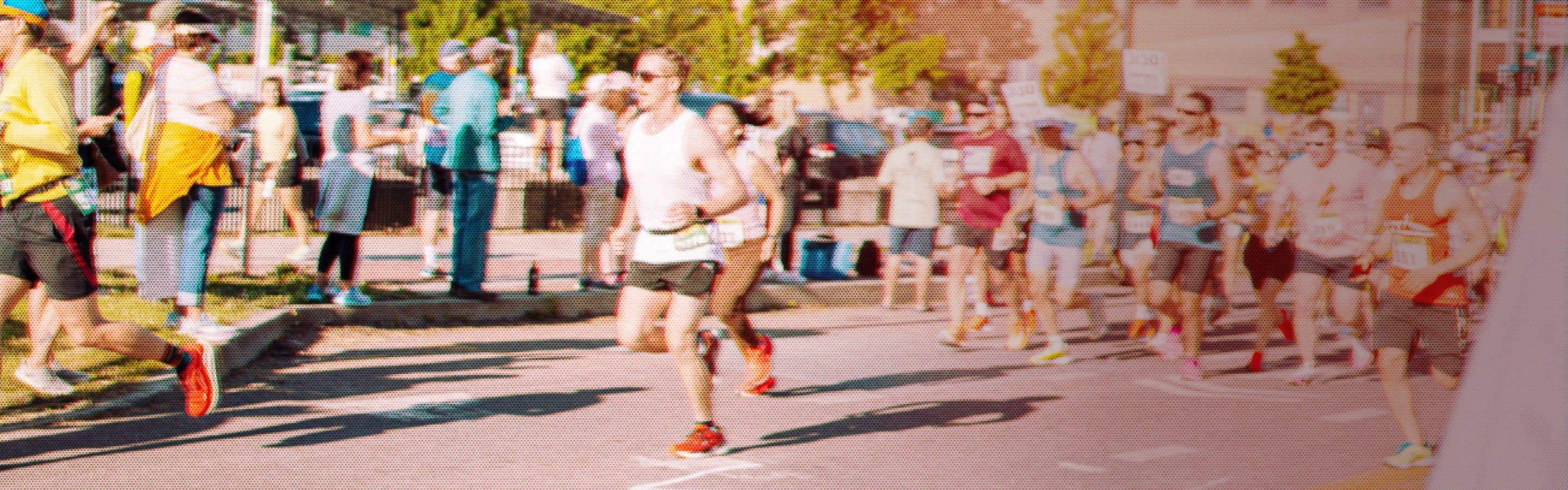 A runner at the start of a marathon wearing the original Darn Tough socks