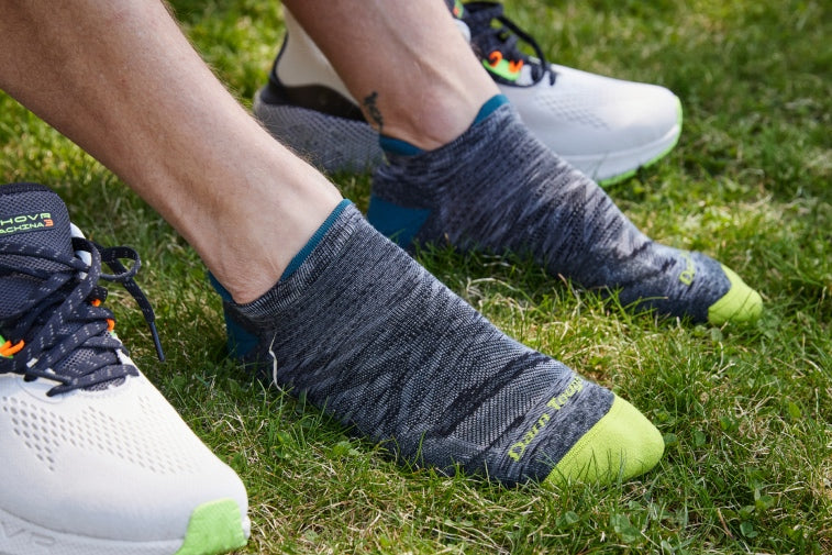 Shop Men's Best Sellers - pair of feet wearing some of our best selling running socks
