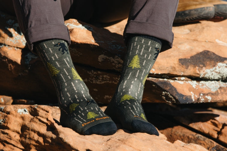 Shop Men's New Socks - pair of feet in new men's hiking socks