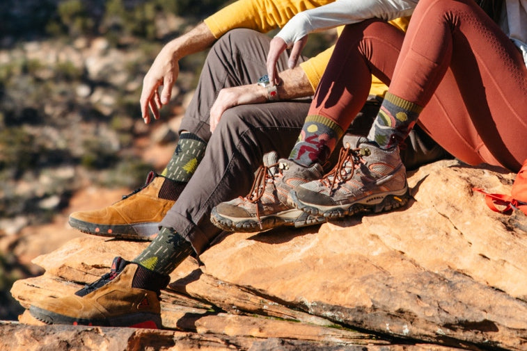 Shop matching couples gifts. Two hikers wearing coordinated Darn Tough socks. 