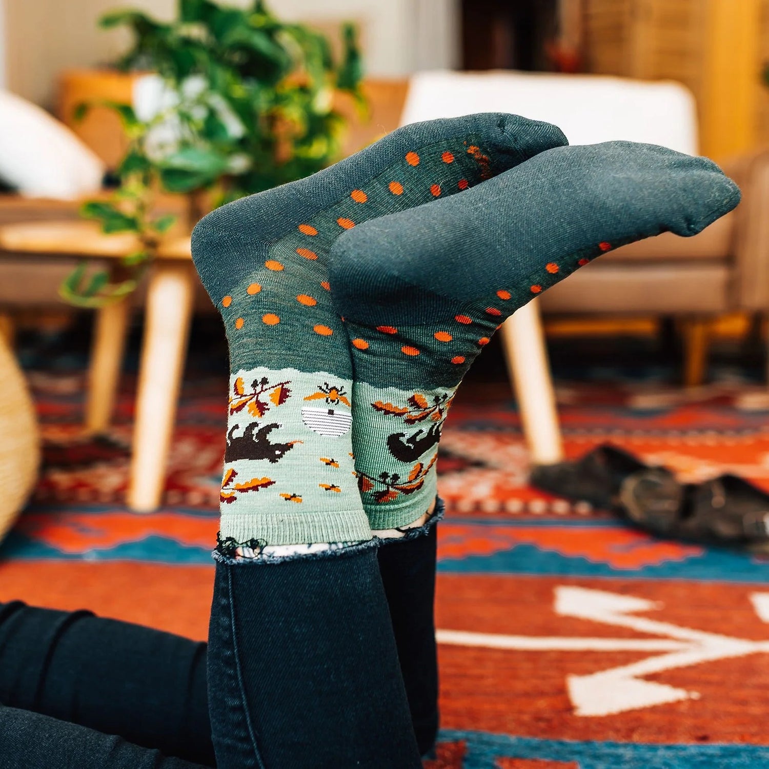 Model wearing the women's wild life crew lifestyle sock in forest
