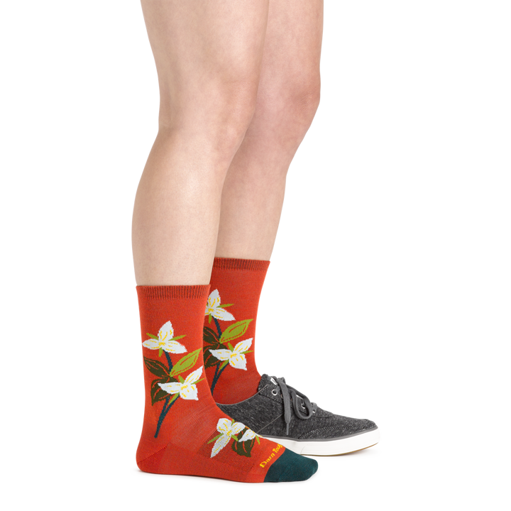 Woman wearing Tomato Blossom Crew Lightweight Lifestyle  Socks with a casual canvas shoe on one foot.