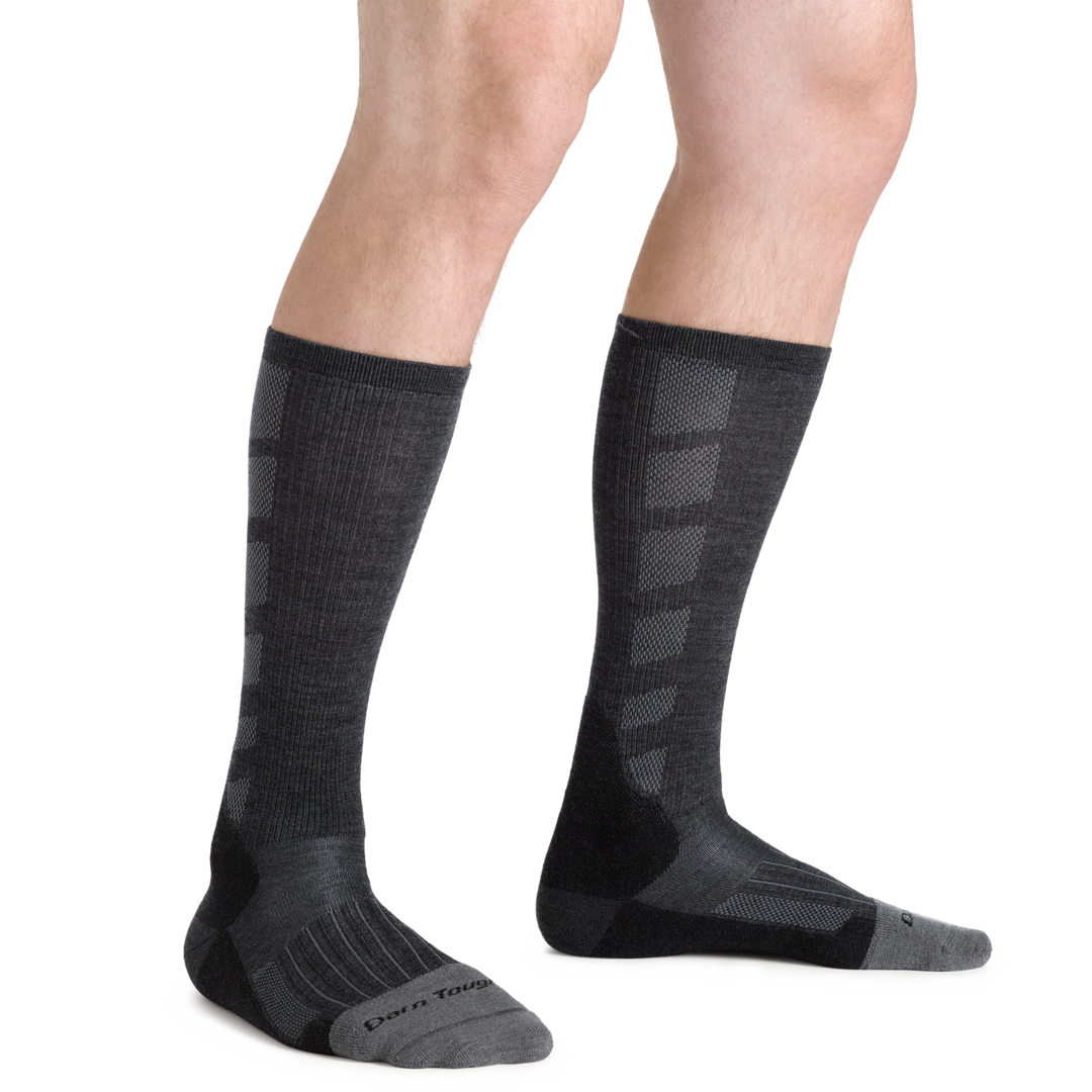 Model facing to the right wearing the Men's Stanley K Mid-Calf Lightweight Work Boot Sock in black