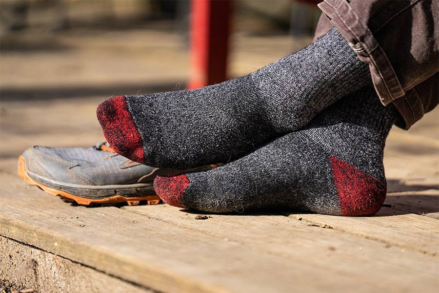 Feet wearing the mountaineering socks, our warmest hiker socks