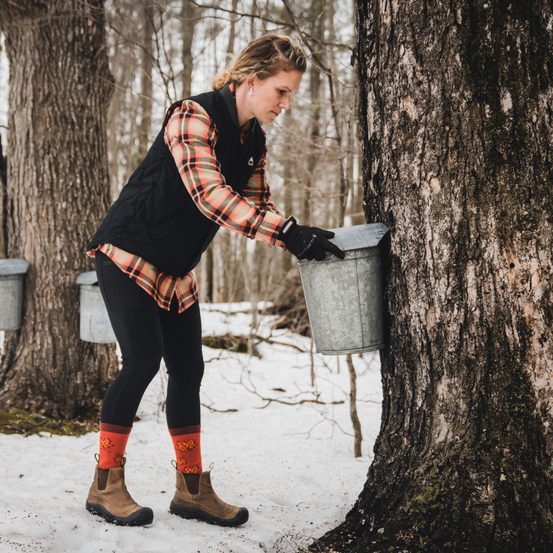 Model checking a sap bucket on a tree wearing the 4088 sweet as syrup in low cut boots