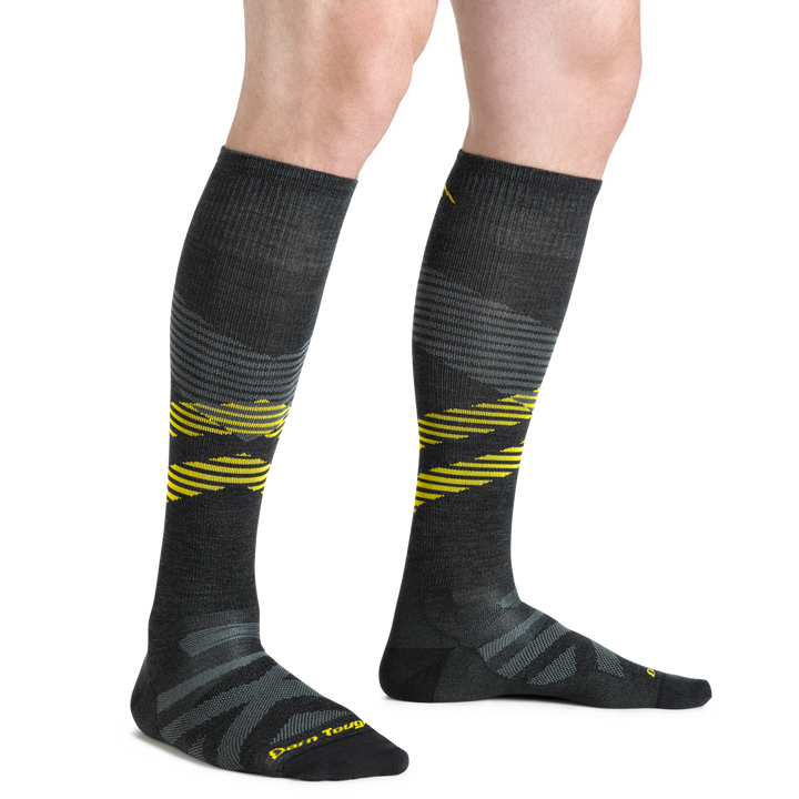 Model wearing Men's Pennant RFL Over-the-Calf Ultra-Lightweight Ski and Snowboard Sock in carbon