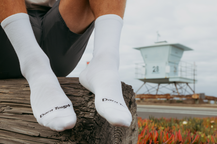 Shop White Socks - feet wearing plane white socks at a crew height