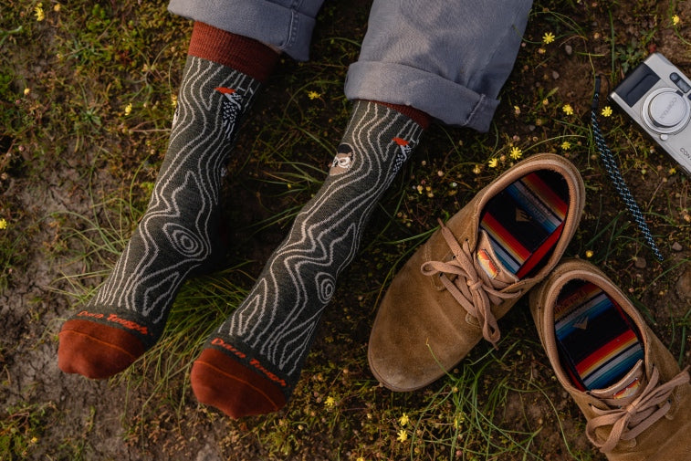 Shop abstract socks - feet wearing blue socks with a cool geometric pattern