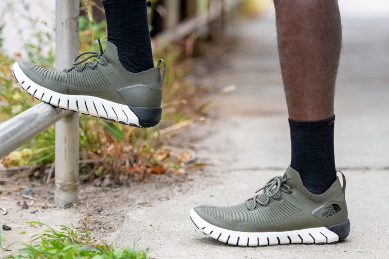Shop Black Socks - feet wearing running shoes and crew height black socks