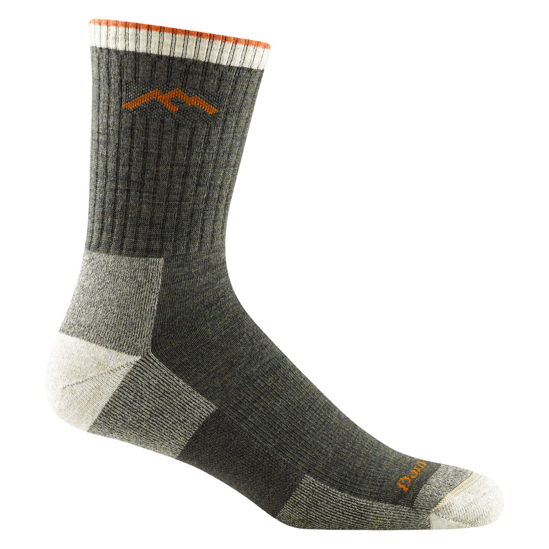 Video of model wearing hiker micro crew socks in olive, rotating around to show the fit of the socks.