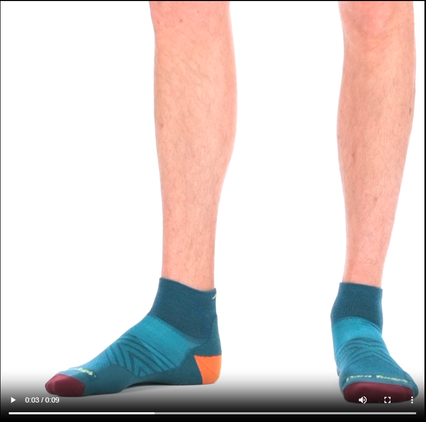 Video of model wearing Running Quarter running socks in Dark Teal, rotating around to show the fit of the socks.