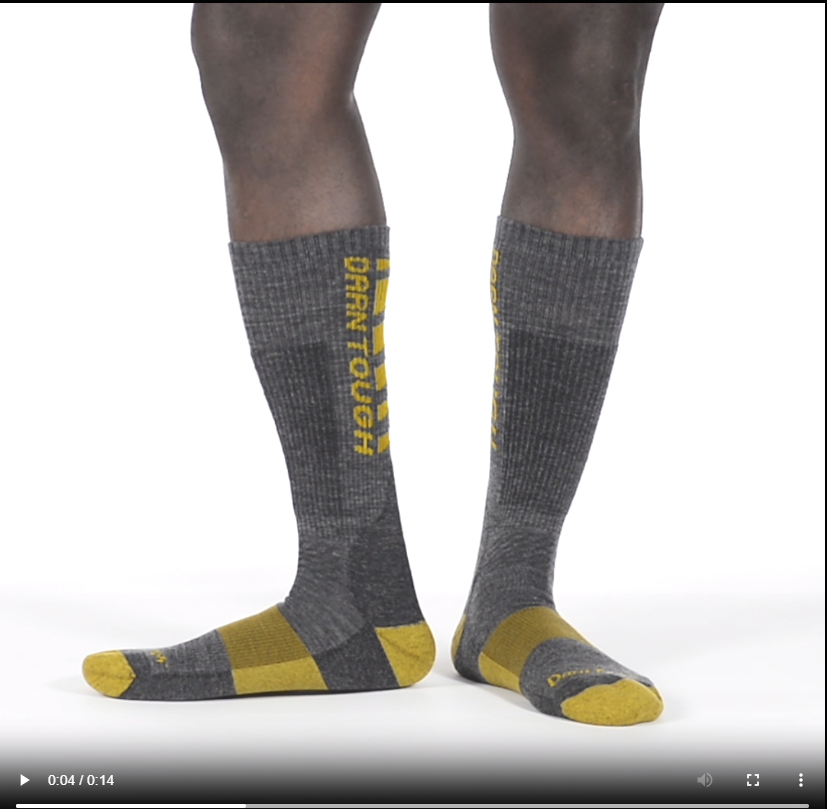Model walking in the 2207 backbone boot sock in gray
