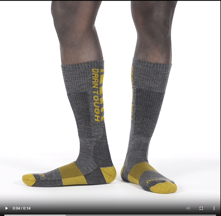 Model walking in the 2207 backbone boot sock in gray