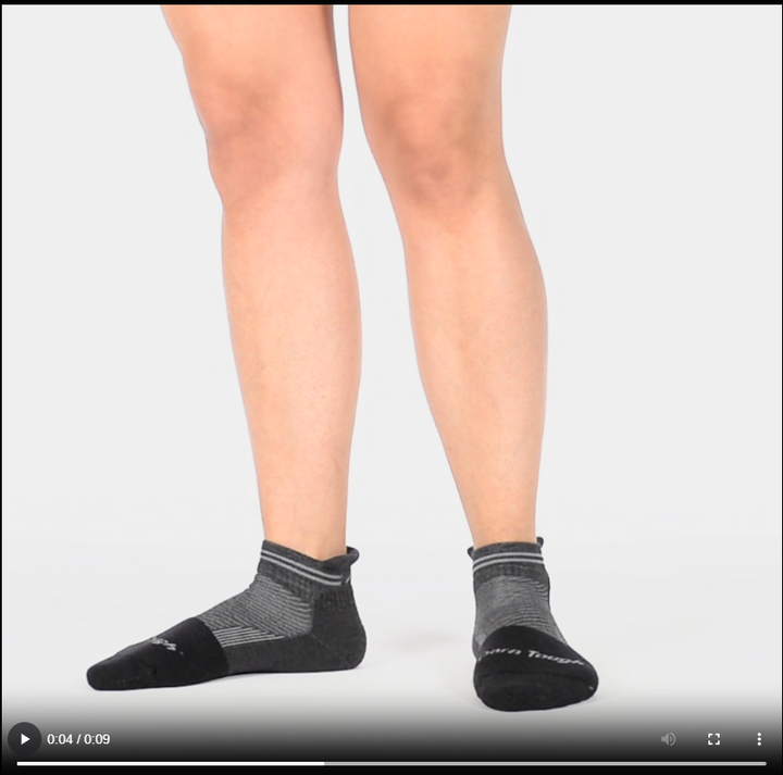 Model walking in the 2210 no show steely sock in gravel