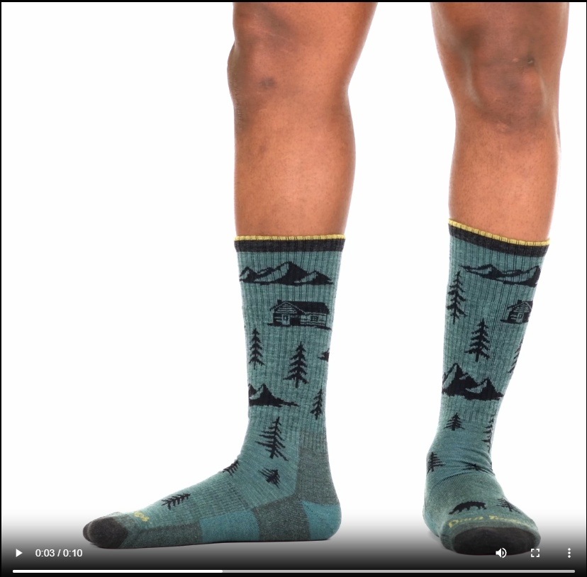 Model walking in the 1964 ABC boot sock in teal