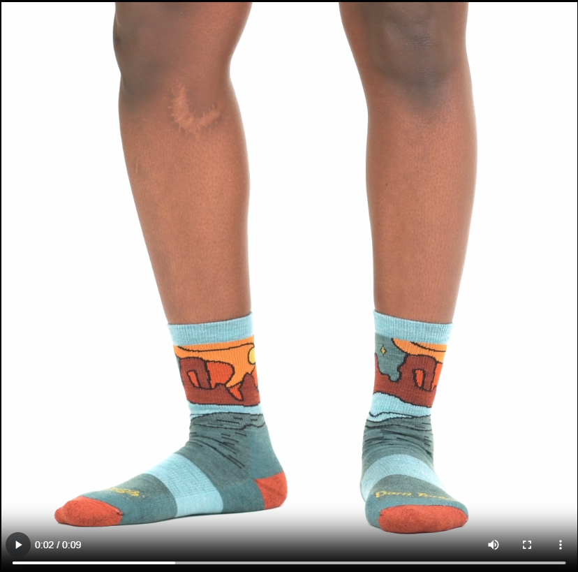 Model walking in 5023 celeste micro crew sock in teal