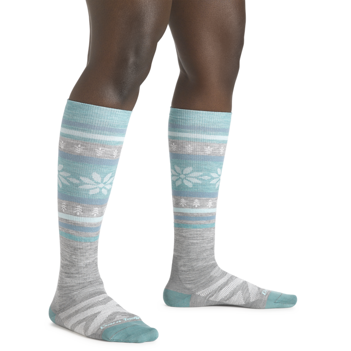 Close up of model standing wearing Women's Alpine LIghtweight Over-the-Calf Ski and Snowboard Sock