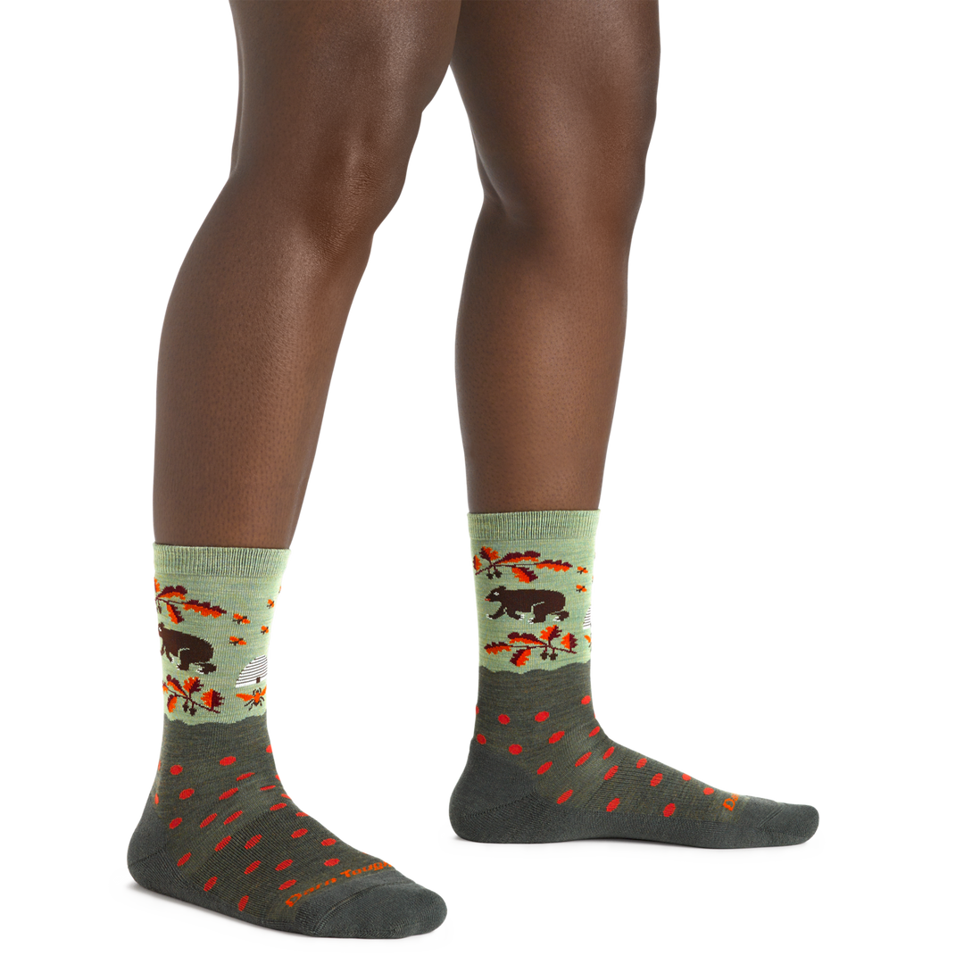 Woman wearing Women's Wild Life Crew Lightweight Lifestyle Socks in Forest showing ant eater and leaf design