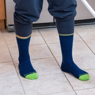 Close up of model standing in a kitchen wearing the men&