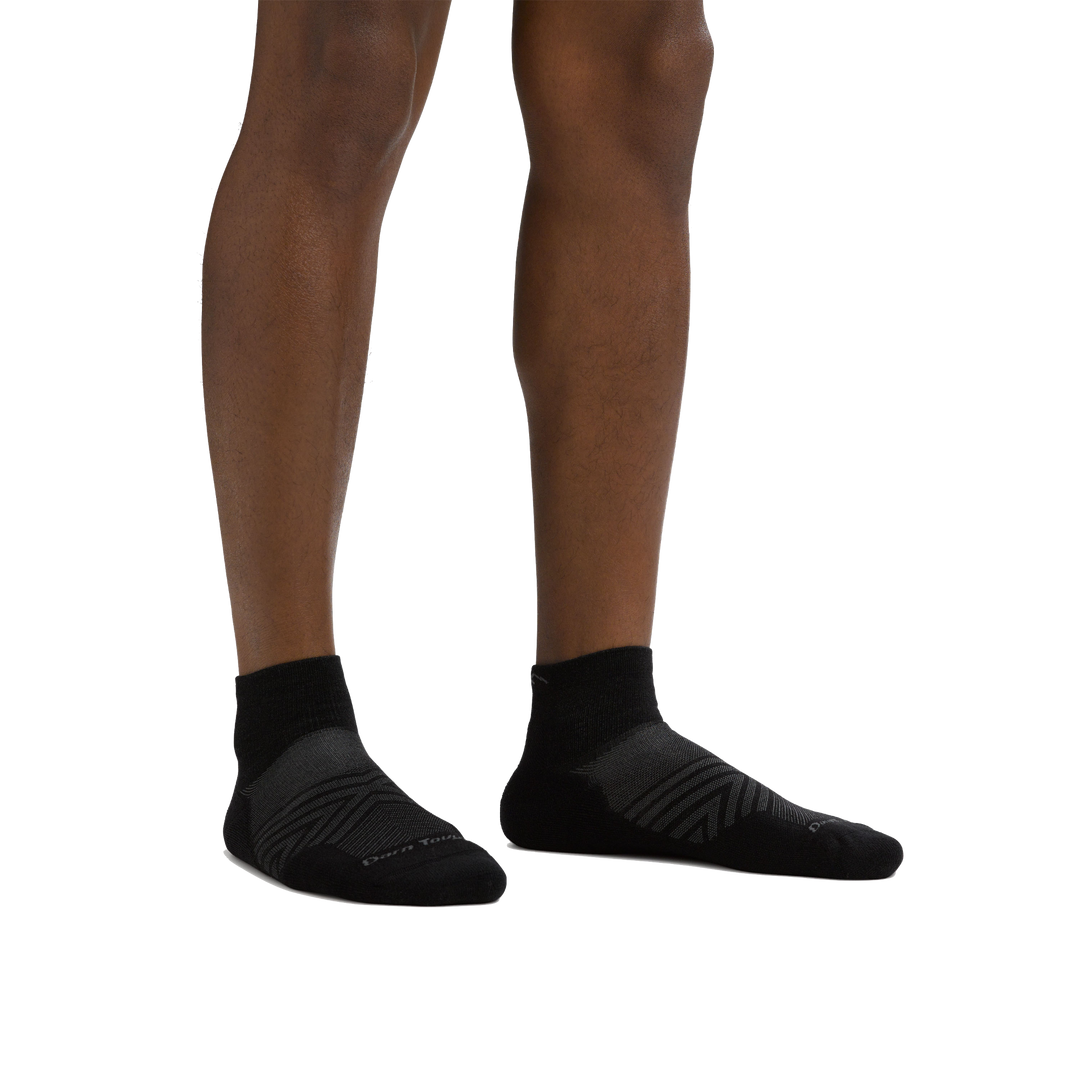 Man standing barefoot wearing Coolmax Run Quarter Ultra-Lightweight Running Sock in Black