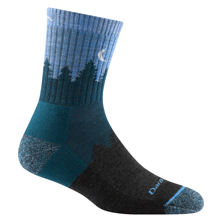 Reverse side of women's treeline micro crew hiking sock in color blue with tree silhouette and white moon design