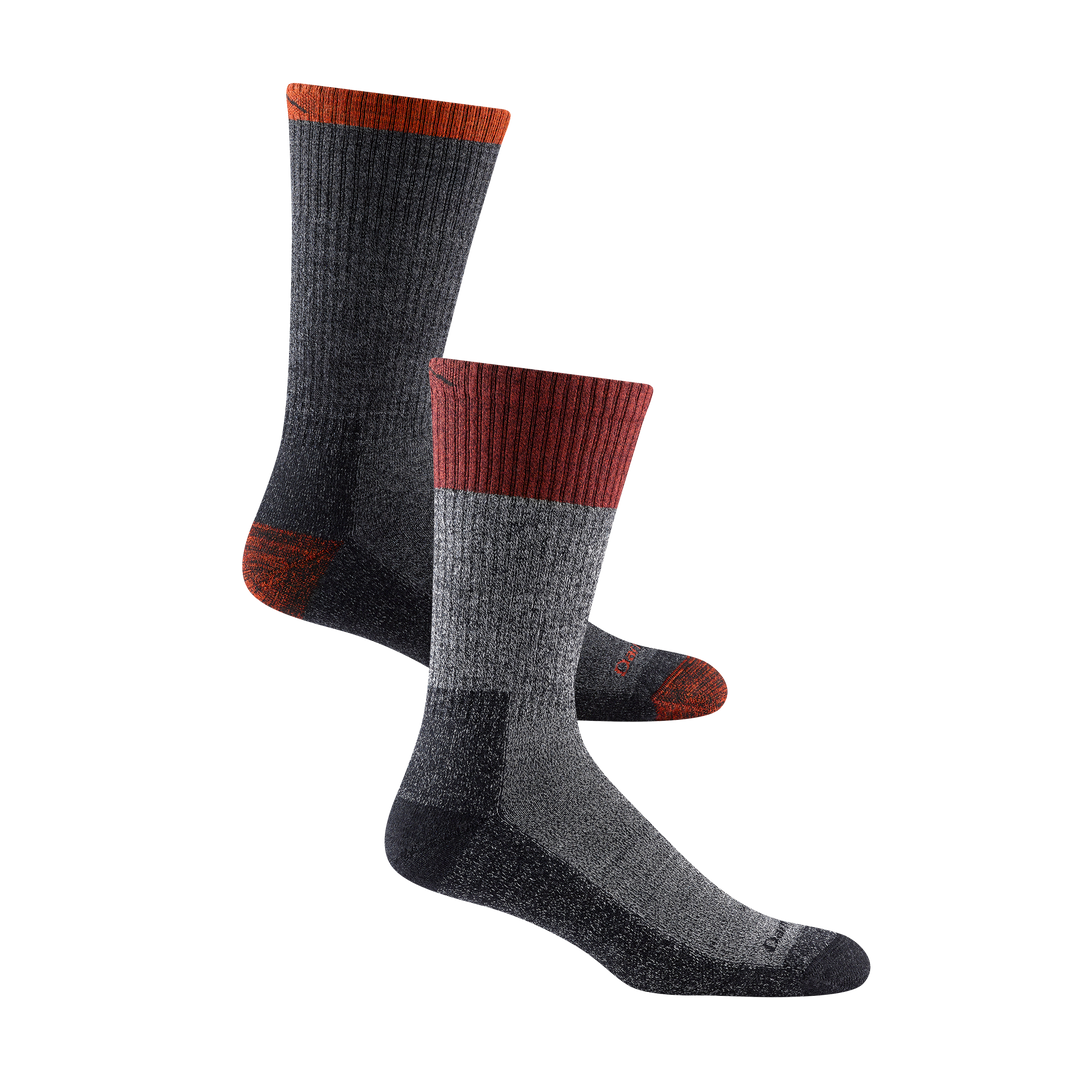 1981 men's scout boot hiking sock in color heathered gray with black toe/heel accents and red color block around calf, 1982 men's nomad boot hiking sock in color dark gray with orange toe/heel accents and darn tough signature on forefoot 