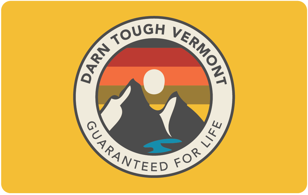 yellow darn tough physical gift card with sunset ridge mountain design and lifetime guarantee