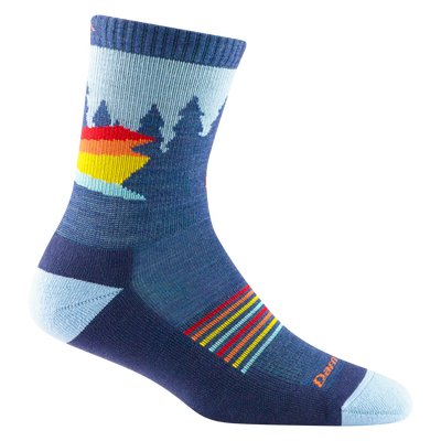 3037 kids van wild micro crew sock in color demin blue with tree silhouettes and red, orange, and yellow striping details