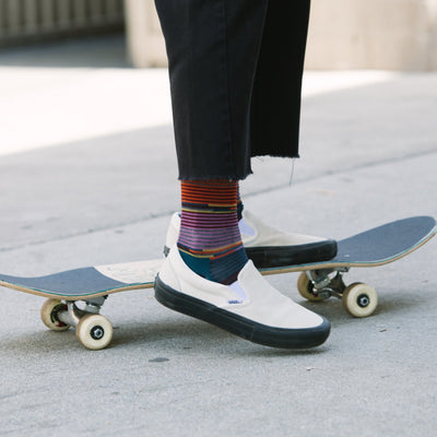 Close up shot of model on a skateboard wearing the women&