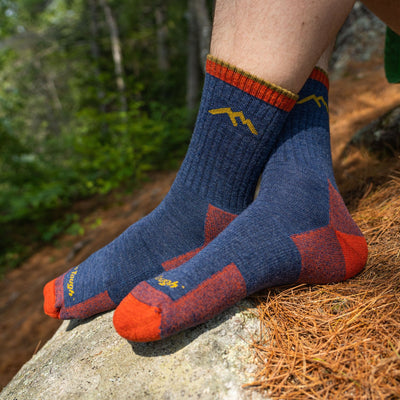 Close up shot of model sitting on a hiking trail wearing men&