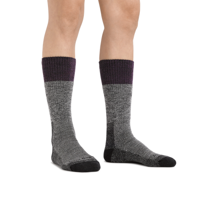 Image of a woman's legs on a white background wearing  Women's Scout Boot Midweight Hiking Socks in Plum