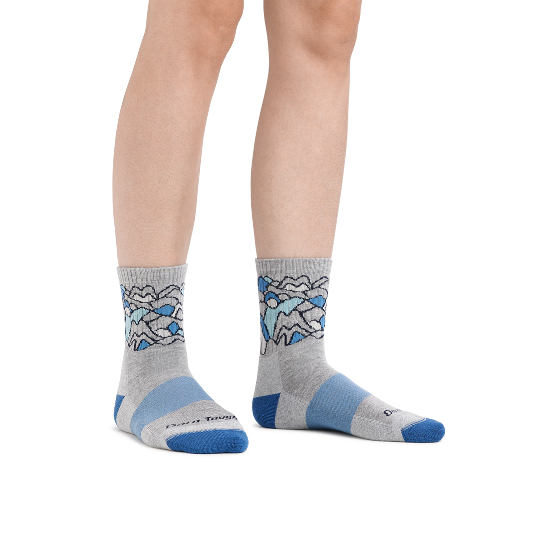 Image of a woman's legs on a white background wearing Women's Coolmax Overlook Micro Crew Midweight Hiking Socks in Light Gray
