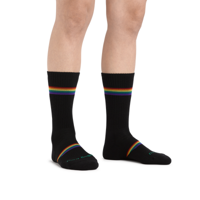 Image of a woman's legs on a white background wearing Women's Prism Crew Lightweight Athletic Socks in Black