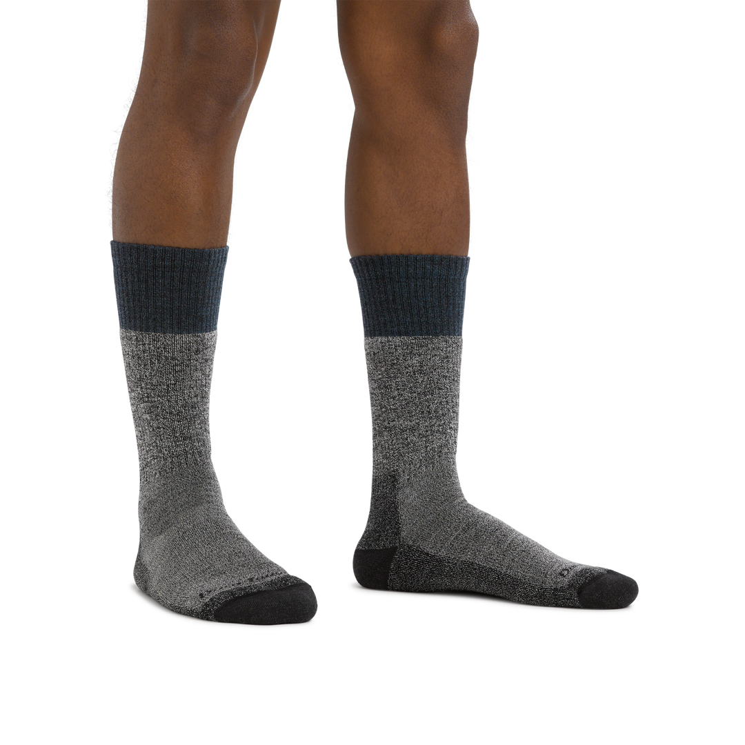 Man standing barefoot wearing Scout Boot Midweight Hiking Socks in Denim