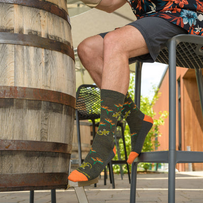 Close up shot of model in a high top chair wearing the men&