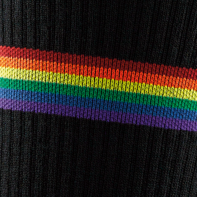 Close up swatch of the men's prism crew athletic sock in black with rainbow stripe details around calf and forefoot