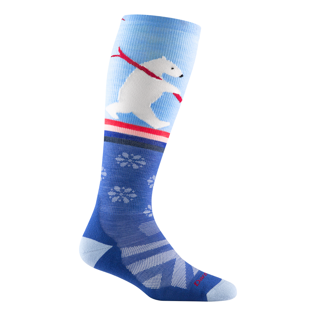 Studio shot of due north ski and snowboard sock. it is blue with snowflakes and a polar bear carrying red skis.